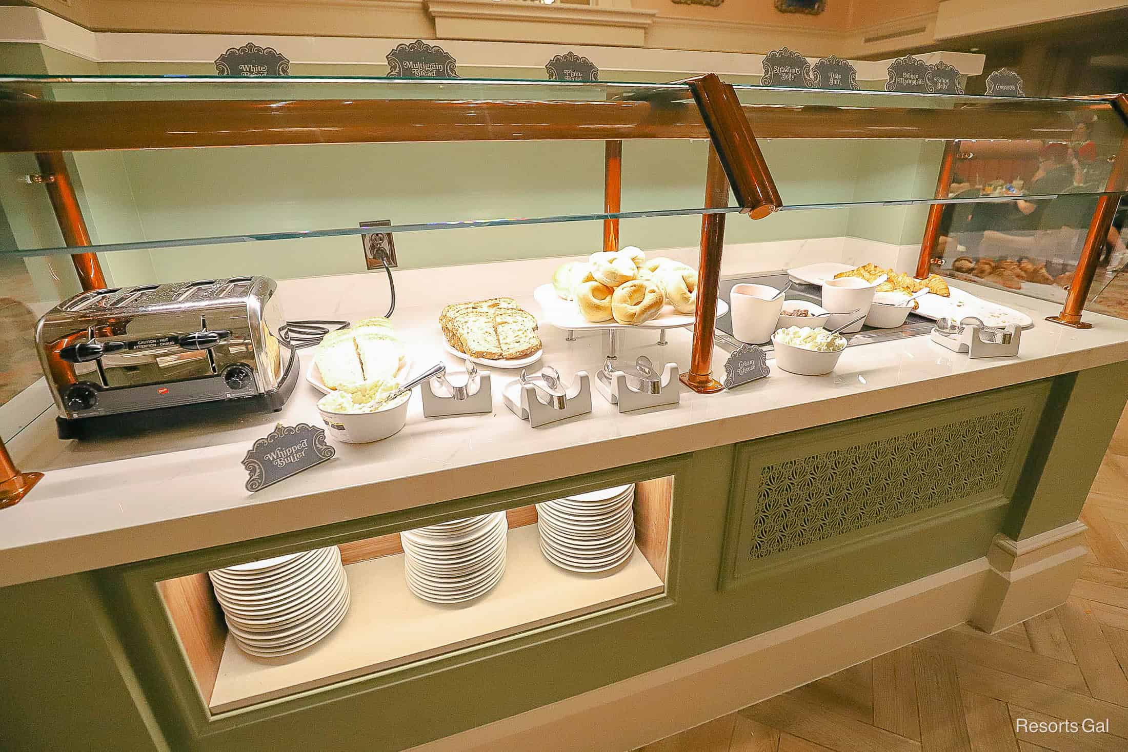 a station with various breads and a toaster 