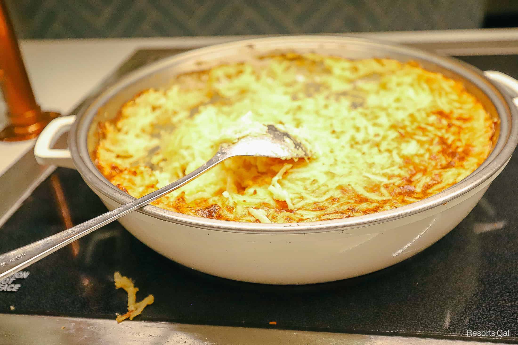 a platter of cheesy hash brown casserole at 1900 Park Fare at Disney's Grand Floridian 