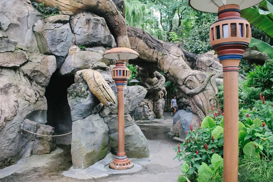 a view of the trails with light poles in browns with reds and blues 