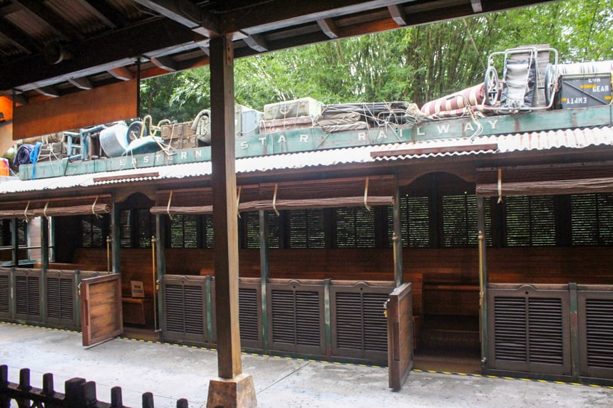 The top of the Wildlife Express Train has lots of luggage strapped to it and it reads Eastern Star Railway. 