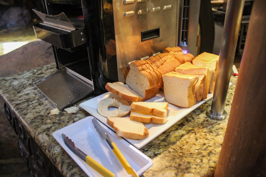 slices of bread next to a toaster oven