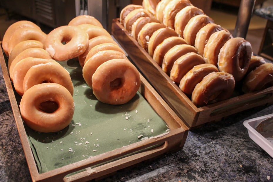 a regular donut and a chocolate covered donut 