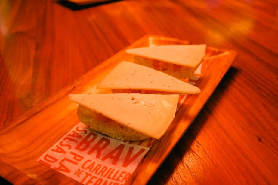 a closeup of the crostini with tomatoes and cheese