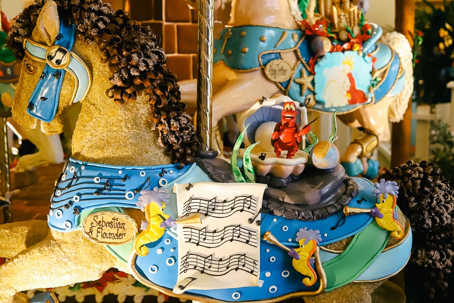 musical notes and seahorses decorate the gingerbread carousel display