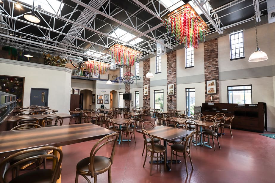 the interior of Sassagoula Floatworks and Food Factory with lights hanging overhead in the dining room 