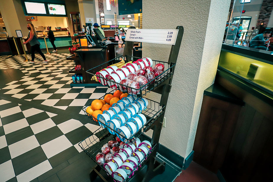 a bin with grab and go cereal and fruit 