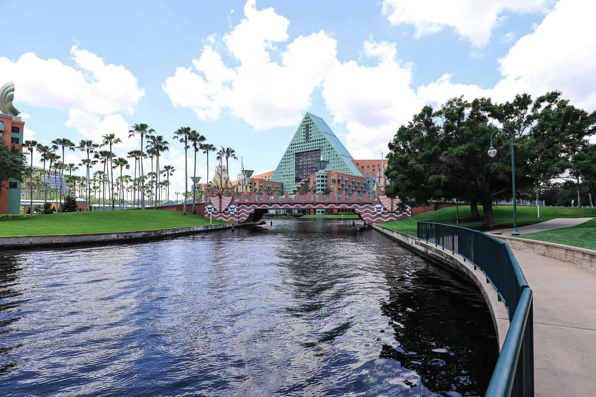 A bridge that crosses the lake with the Dolphin Hotel behind it. 