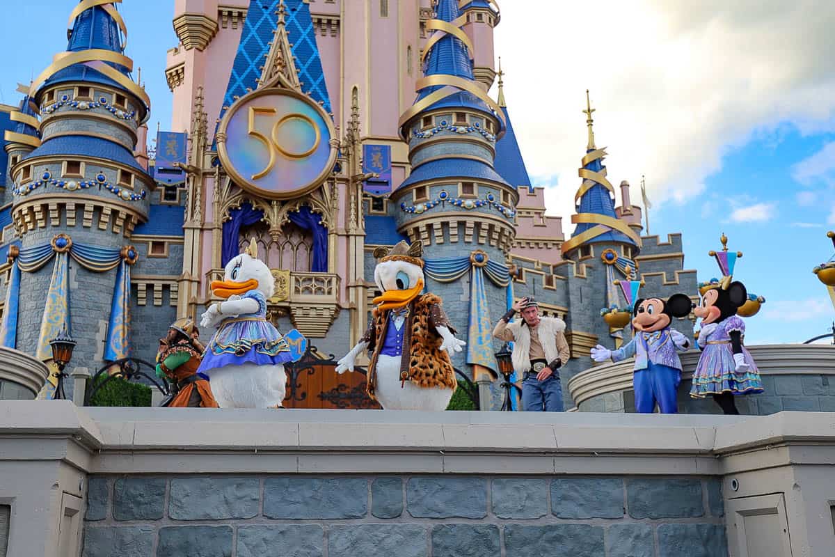 Donald and Daisy on the stage of Cinderella Castle in their Ruffian outfits. 