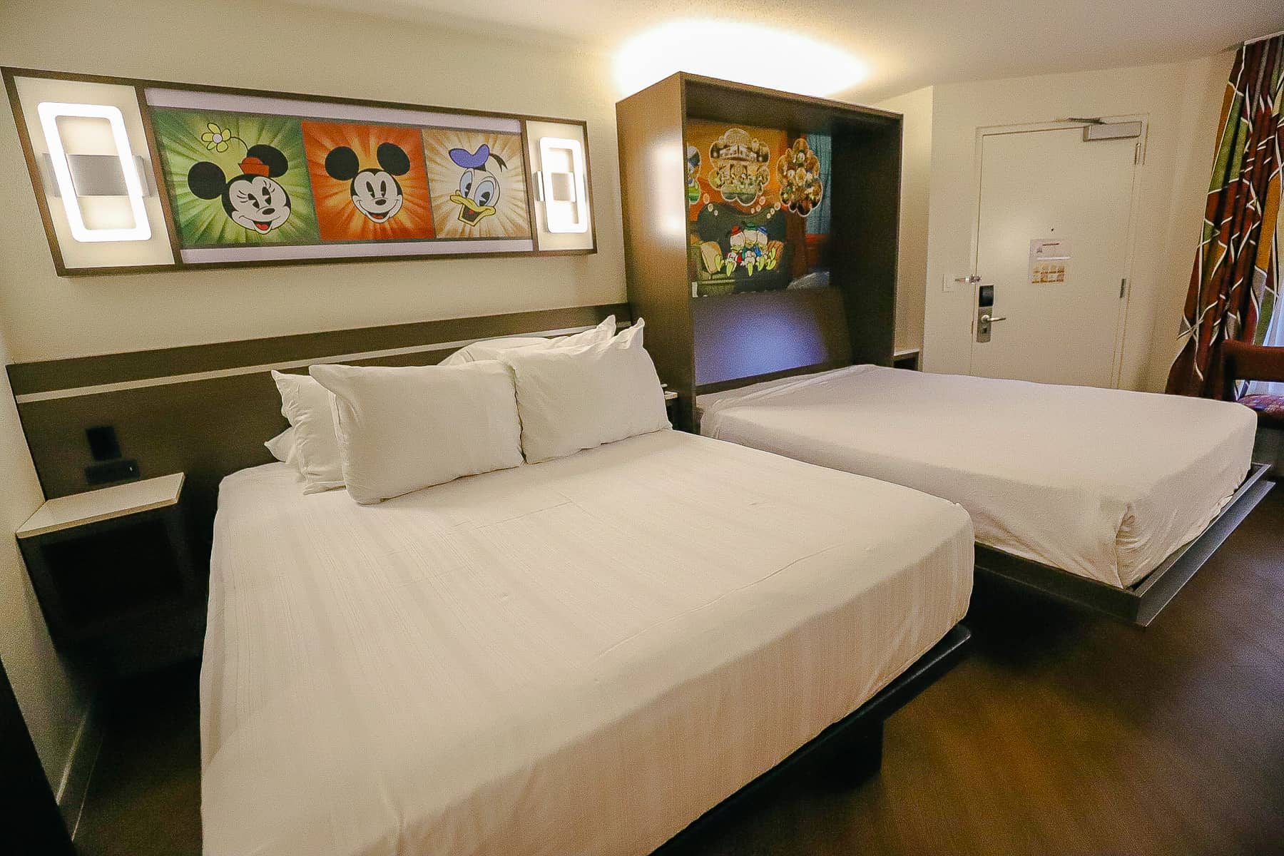 shows the layout of the room with two queen-size beds