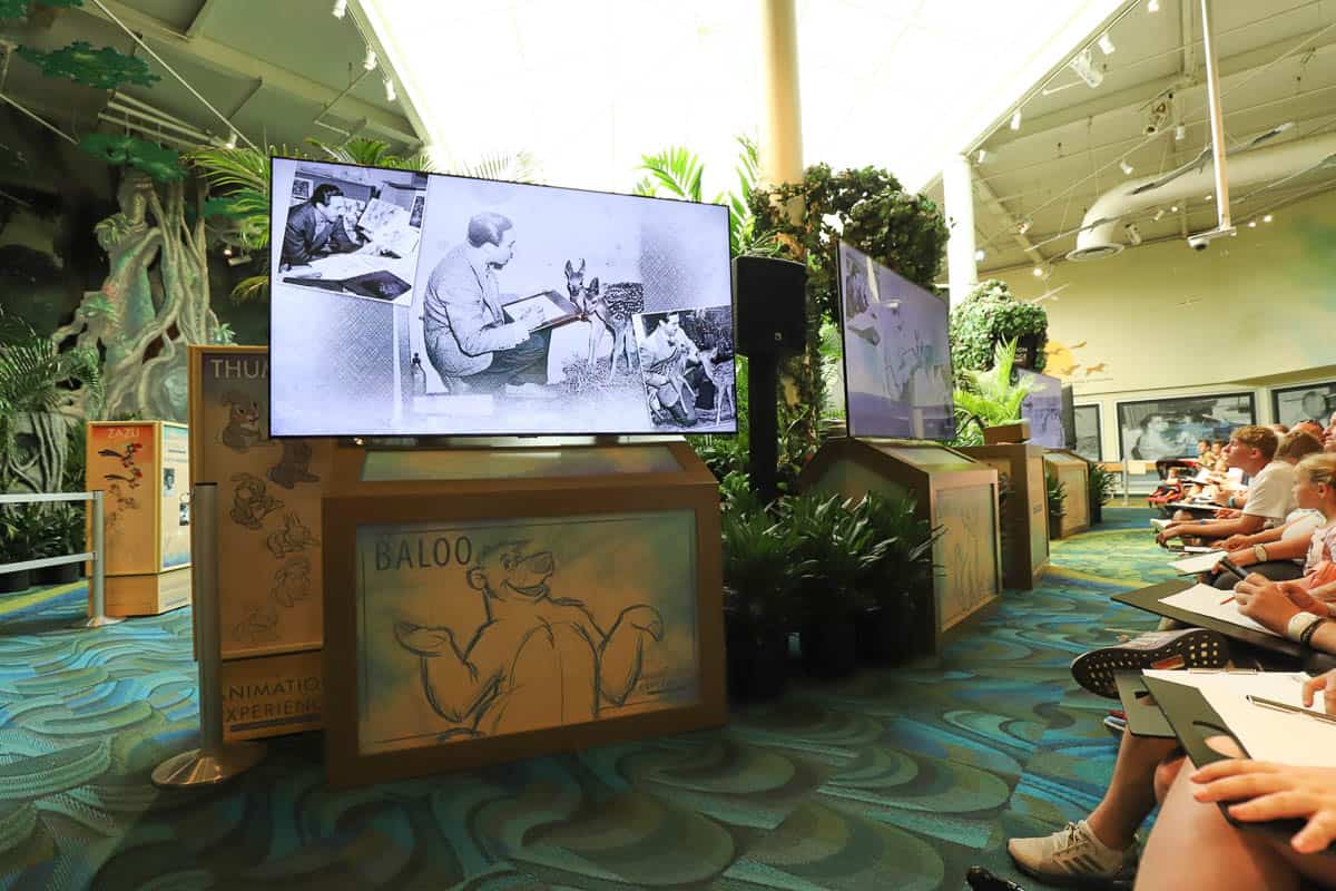 a movie playing on the screen before the drawing part beings at the Animation Experience at Animal Kingdom 