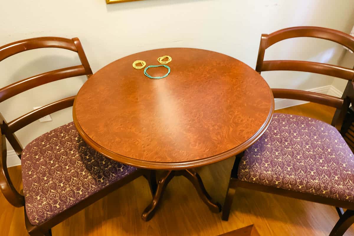 a table with two chairs in a standard room at Port Orleans French Quarter 