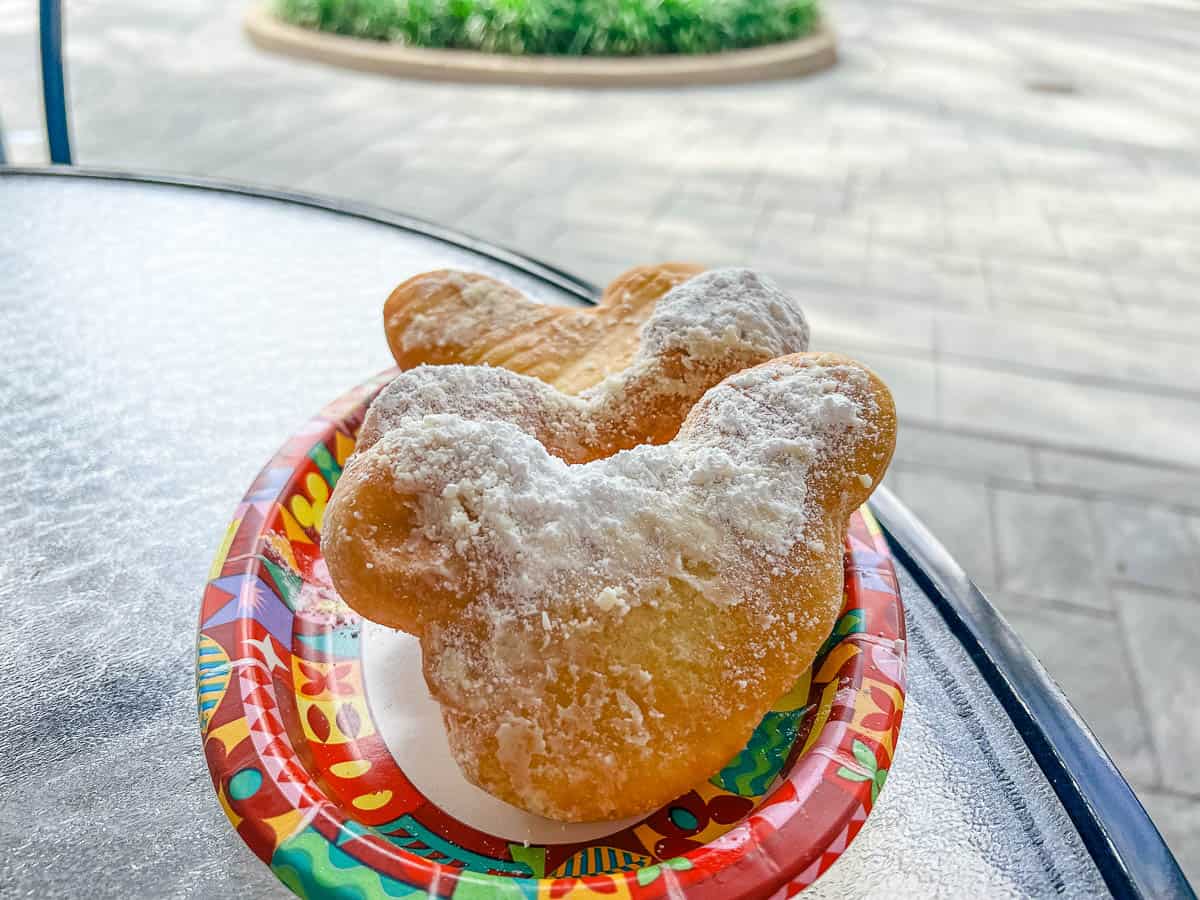 a plate with three Mickey-shaped beignets 
