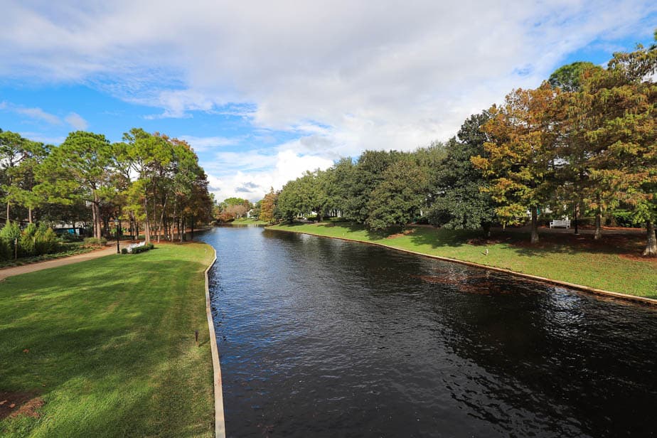 The Sassagoula River with green grass banks on each side of it. 