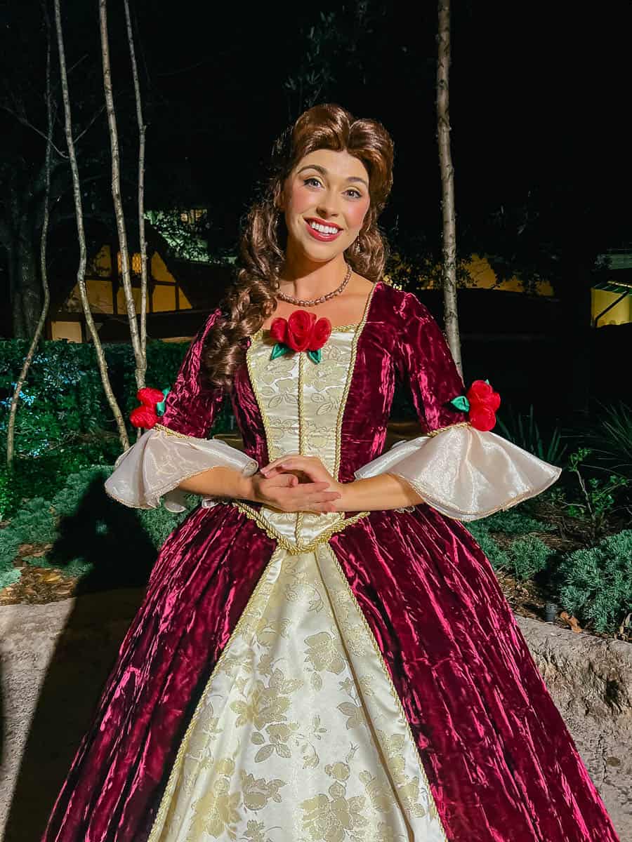 Belle poses for a photo in her red holiday dress.