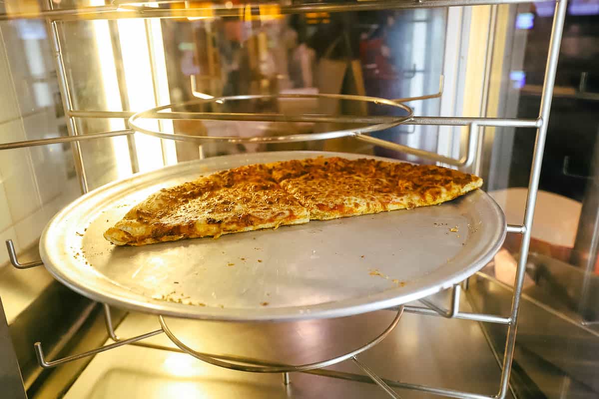 slices of pizza on a tray at All-Star Movies 
