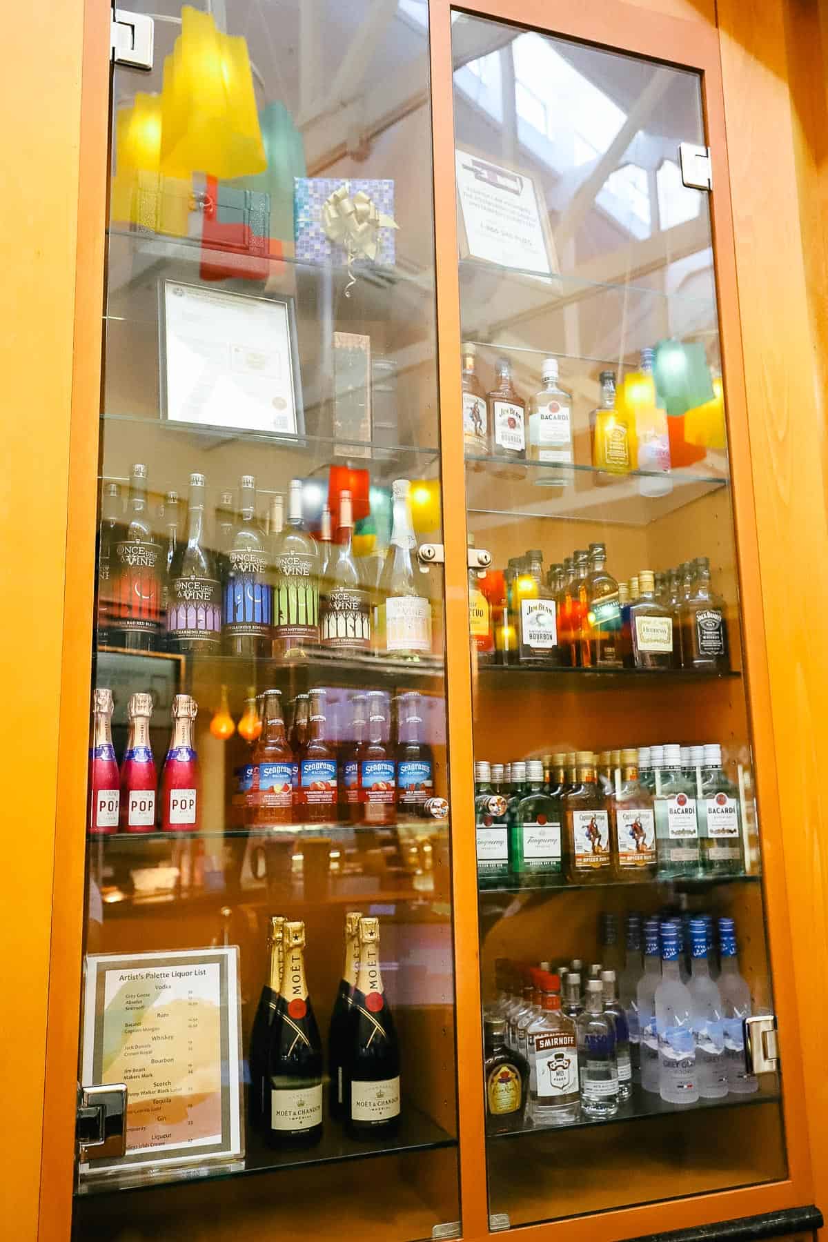 various liquors available for sell behind the register at The Artist's Palette