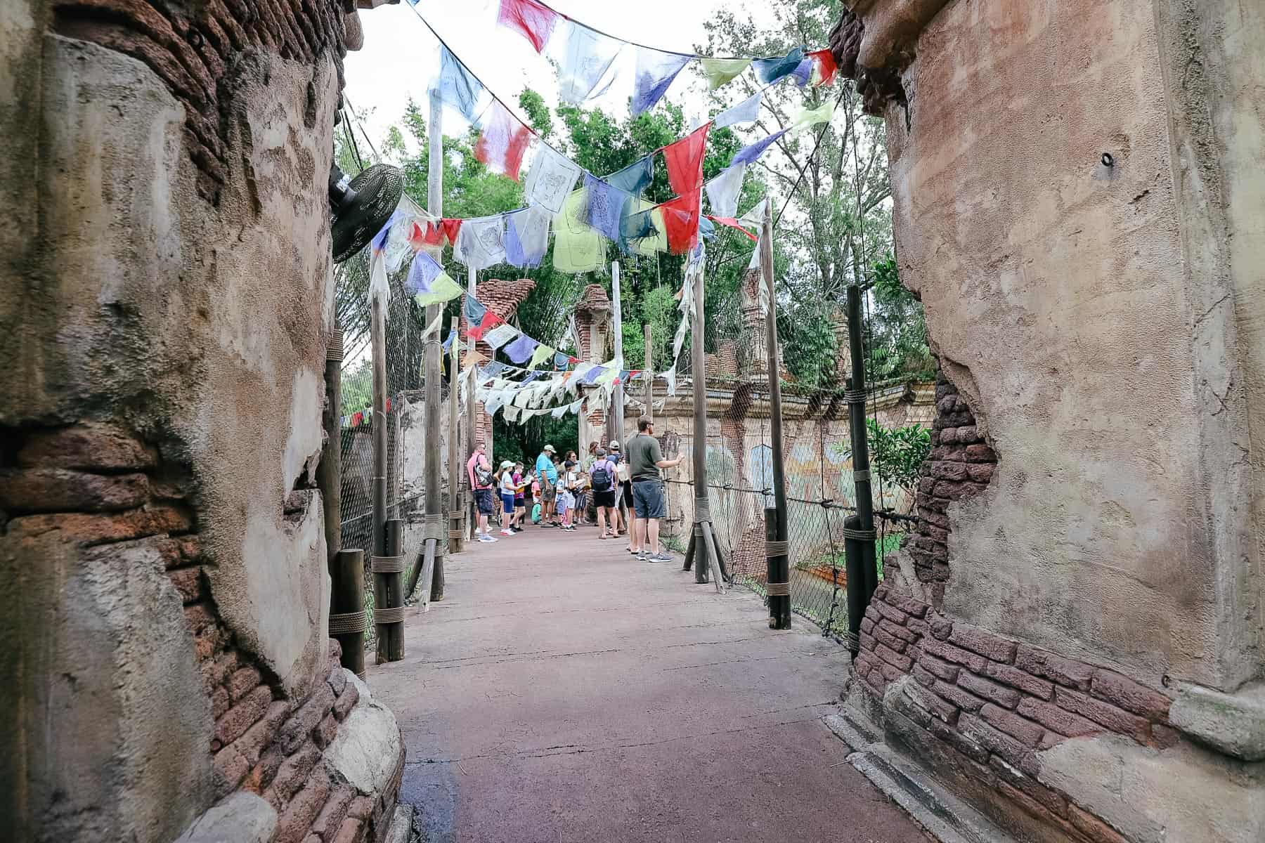 prayer flags strung over a bridge on the Maharajah Jungle Trek 