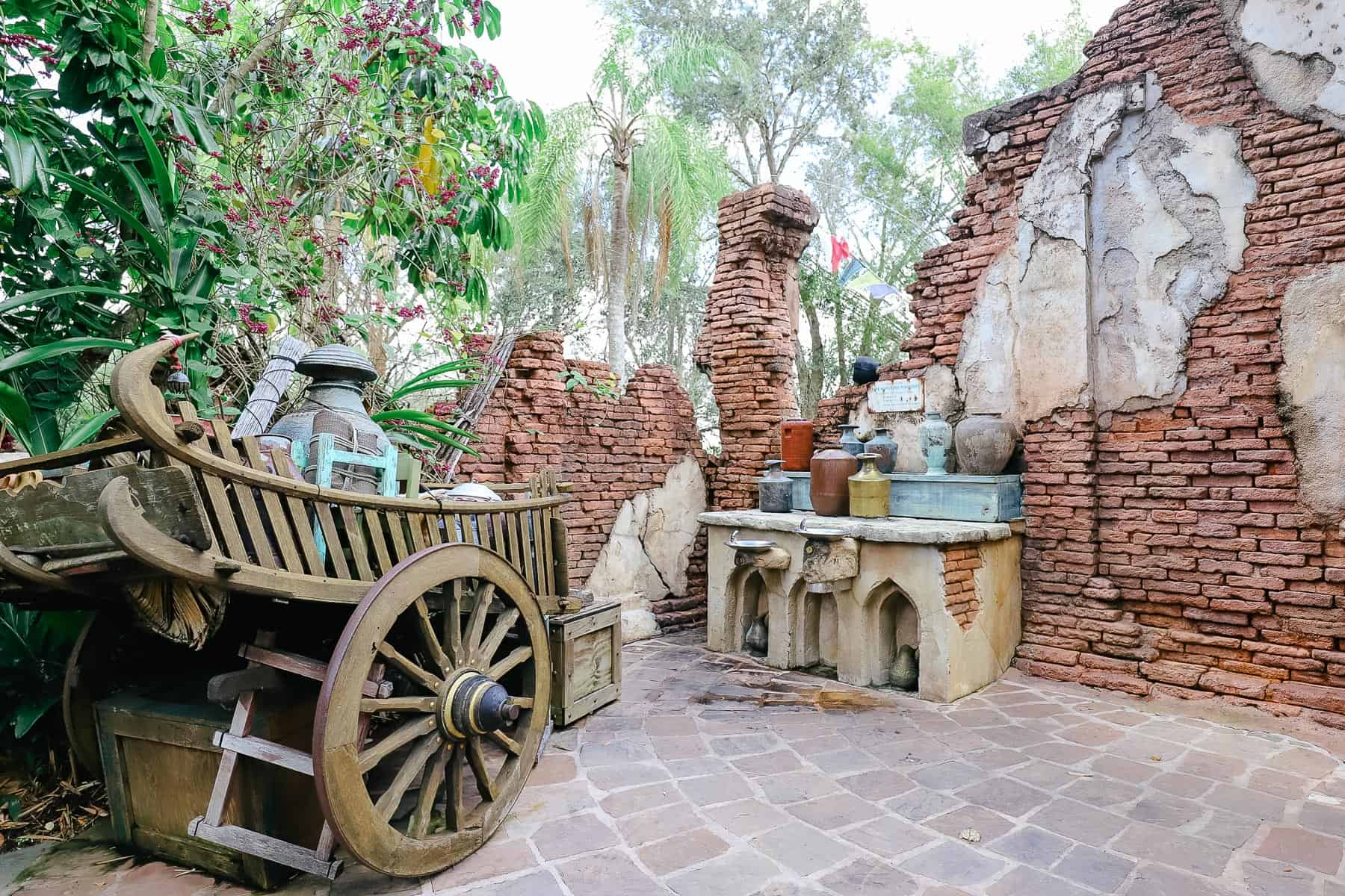 a themed area on the Maharajah Jungle Trek with an old car and stone walls 