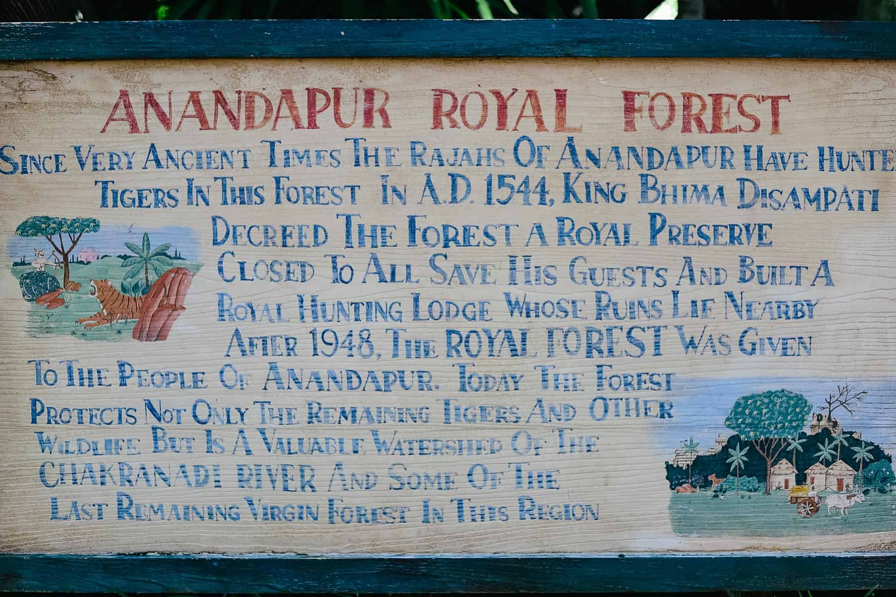 a sign near the trail's entrance that tells the Anandapur Royal Forest story 