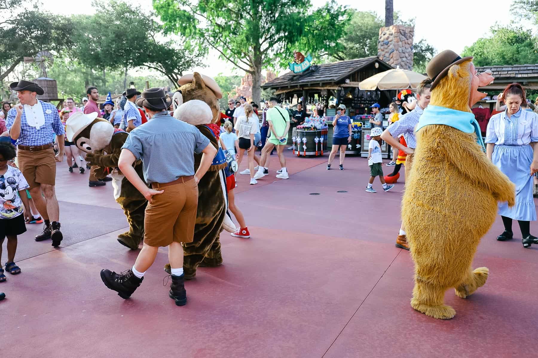 Guests interacting with characters in the Frontierland Hoedown.