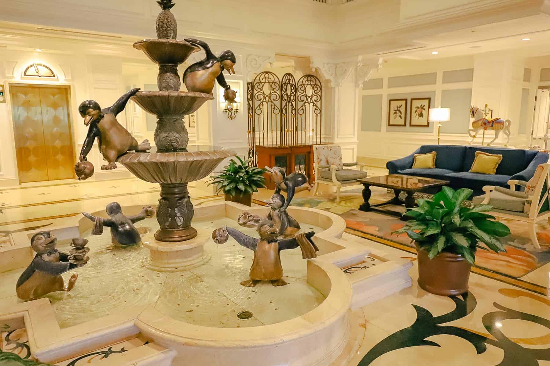 the penguin fountain inside the Grand Floridian Villas lobby 