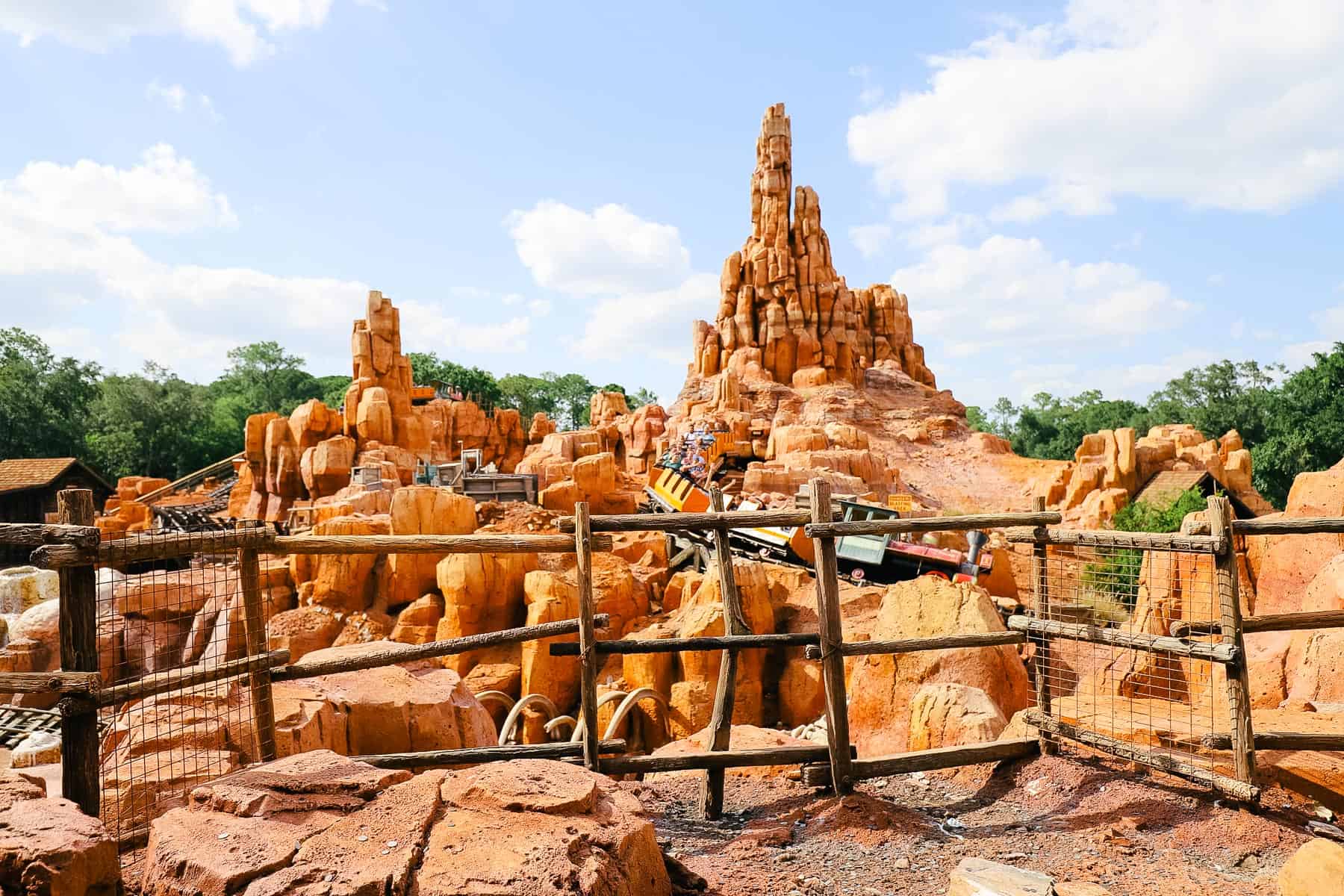 A train car pulls guests over the hill of Big Thunder Mountain Railroad. 