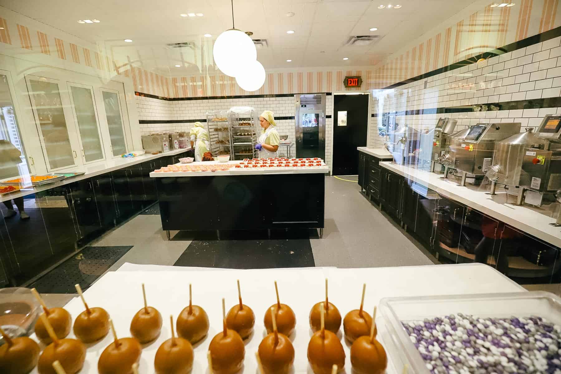 cast members creating treats in the Confection Kitchen