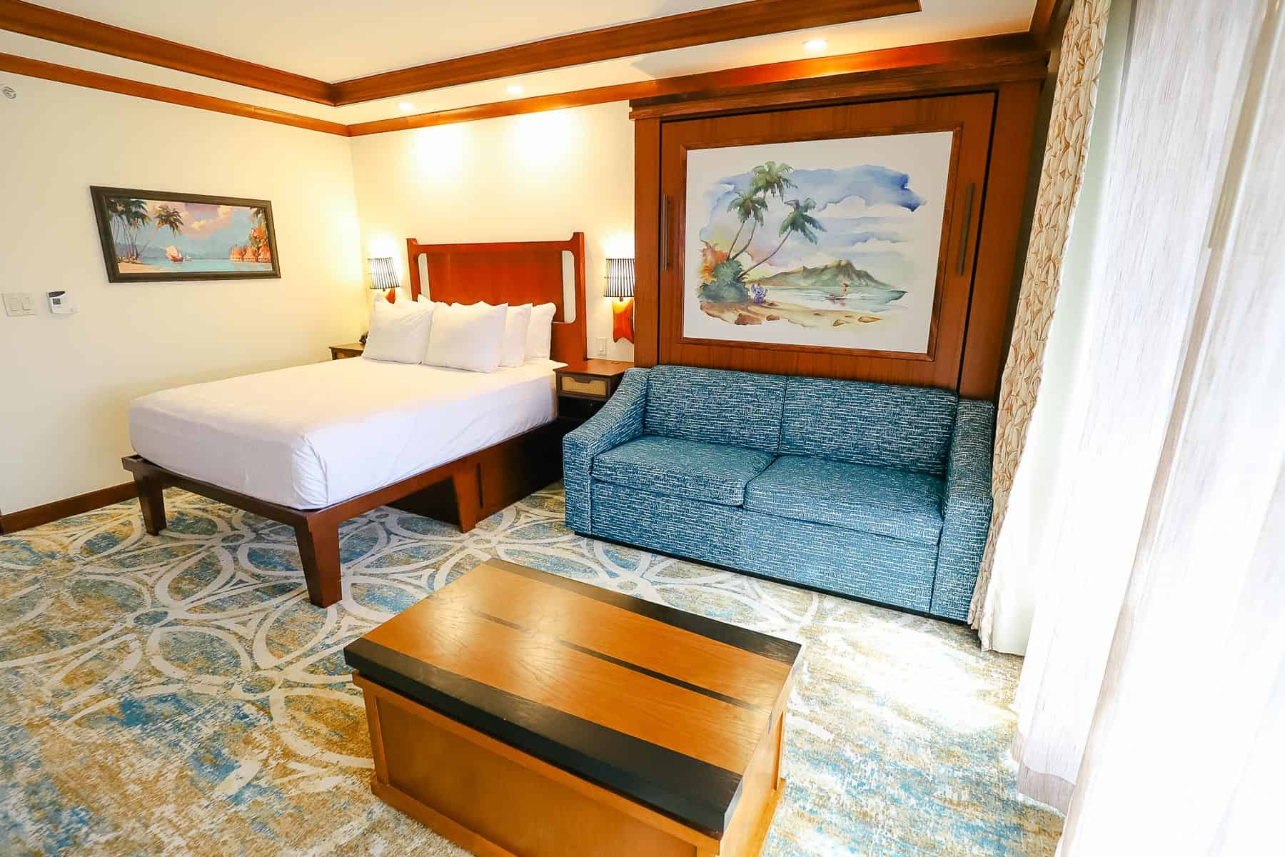 a queen-size bed and a Murphy bed in Polynesian deluxe studio
