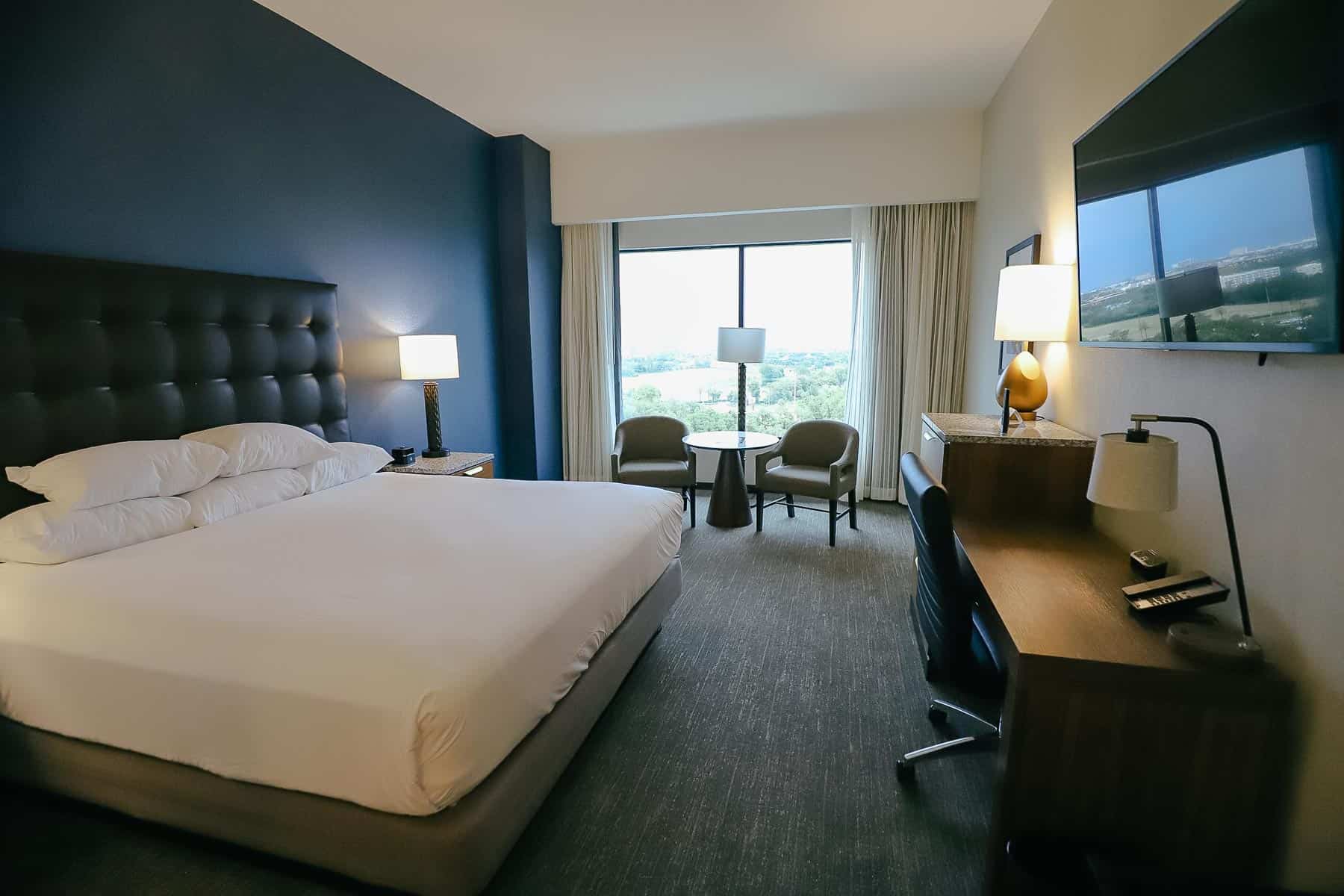 King-size guest room at the Drury Hotel Disney Springs location.