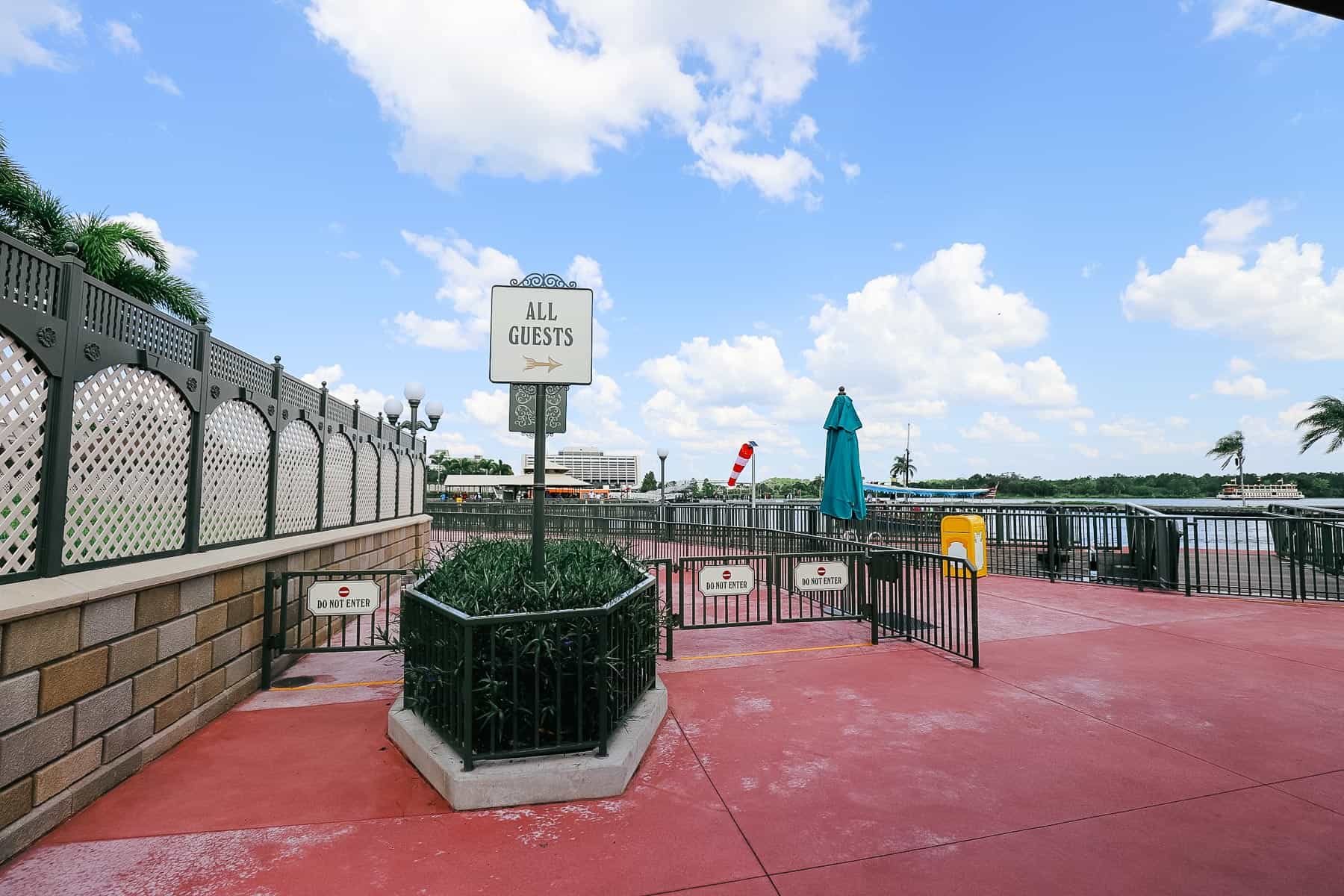 a directional for all guests to walk through the security area at Magic Kingdom 