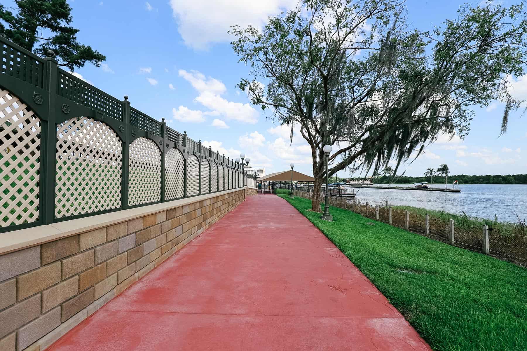 the end of the walkway with red-stained concrete at Magic Kingdom 
