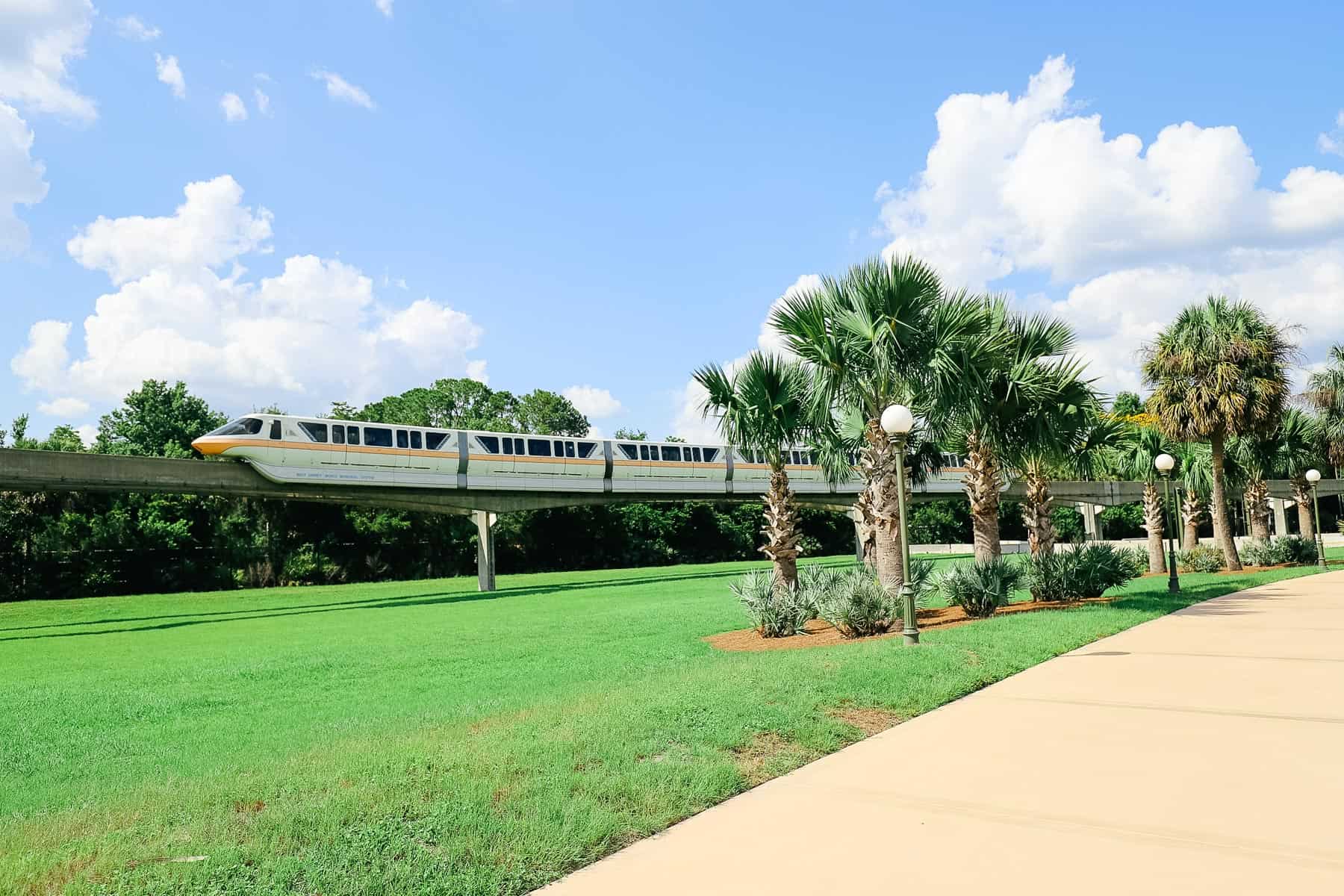 Monorail Peach passes by the walkway from Magic Kingdom to Grand Floridian. 