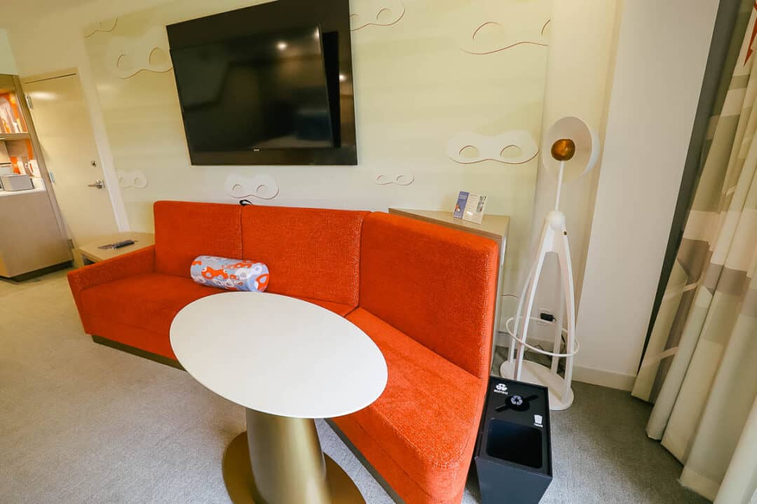 a sofa with table that converts to a bed in Incredibles rooms