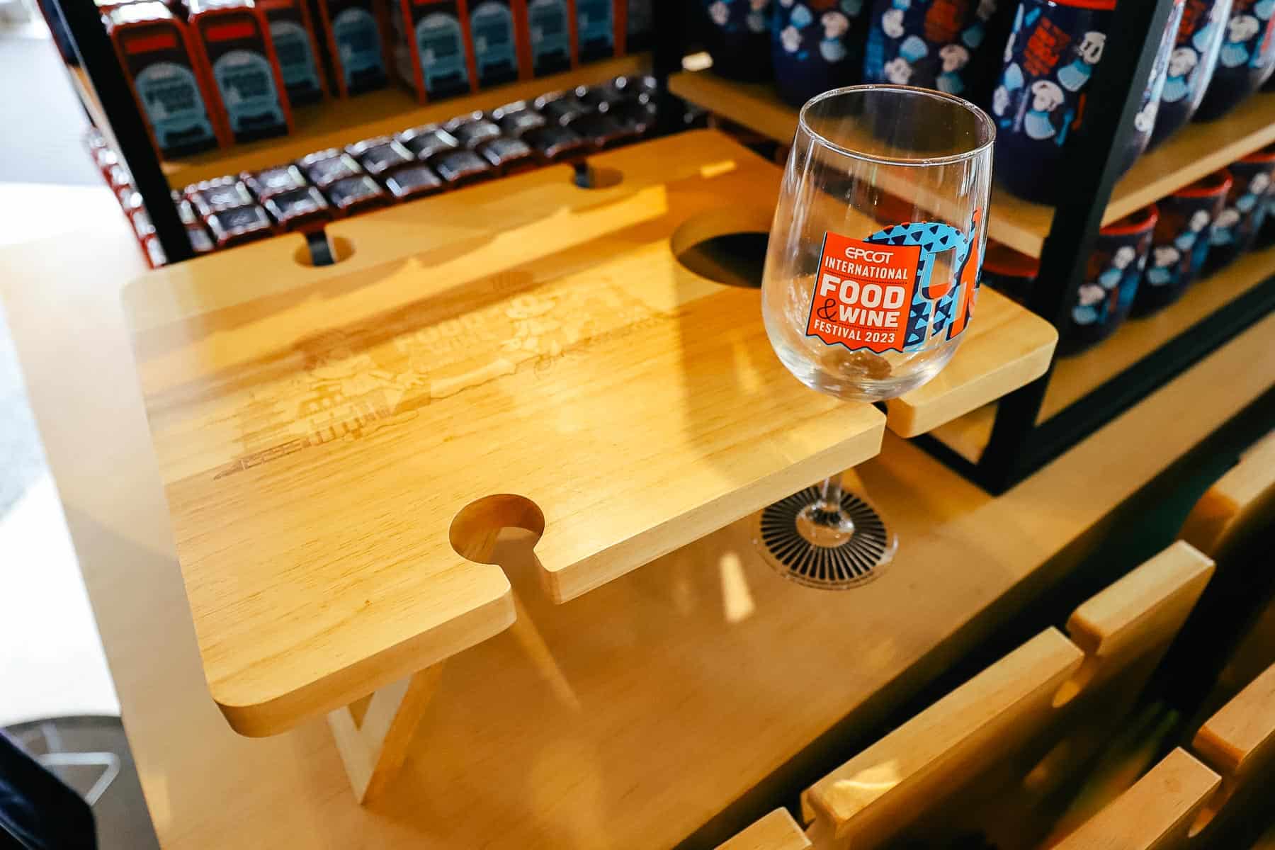 A charcuterie board with cut outs to old stemware. 