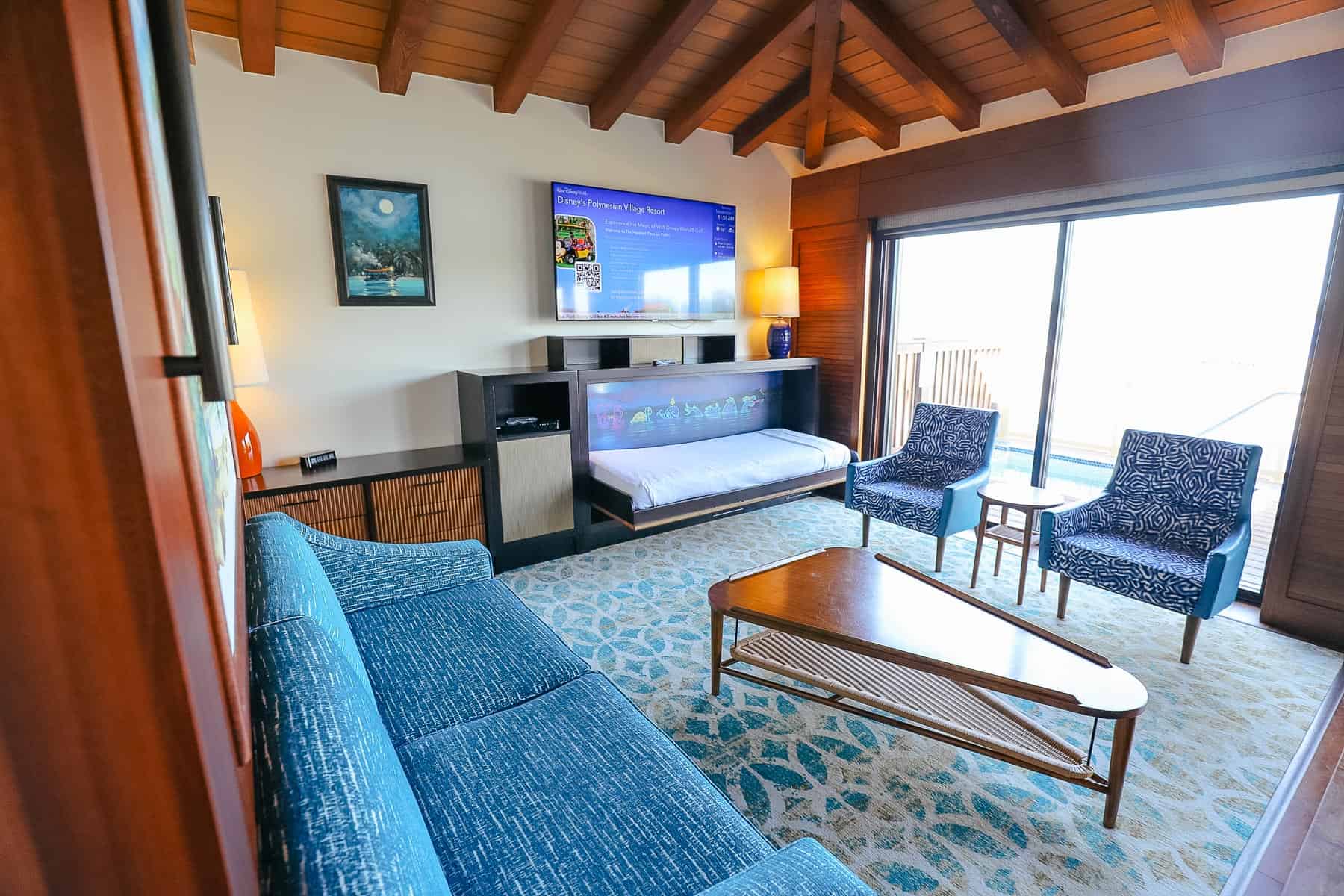 living room with pull-down bed in Bora Bora Bungalow 