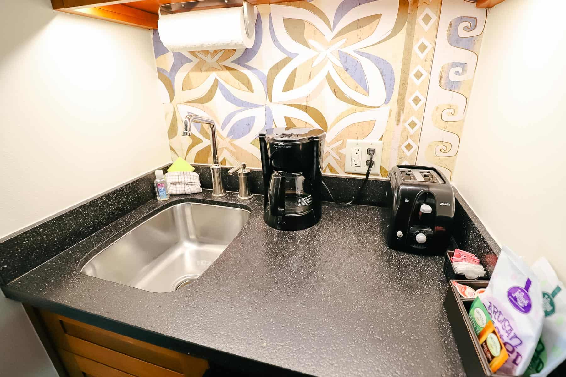 sink, coffee maker, toaster oven 