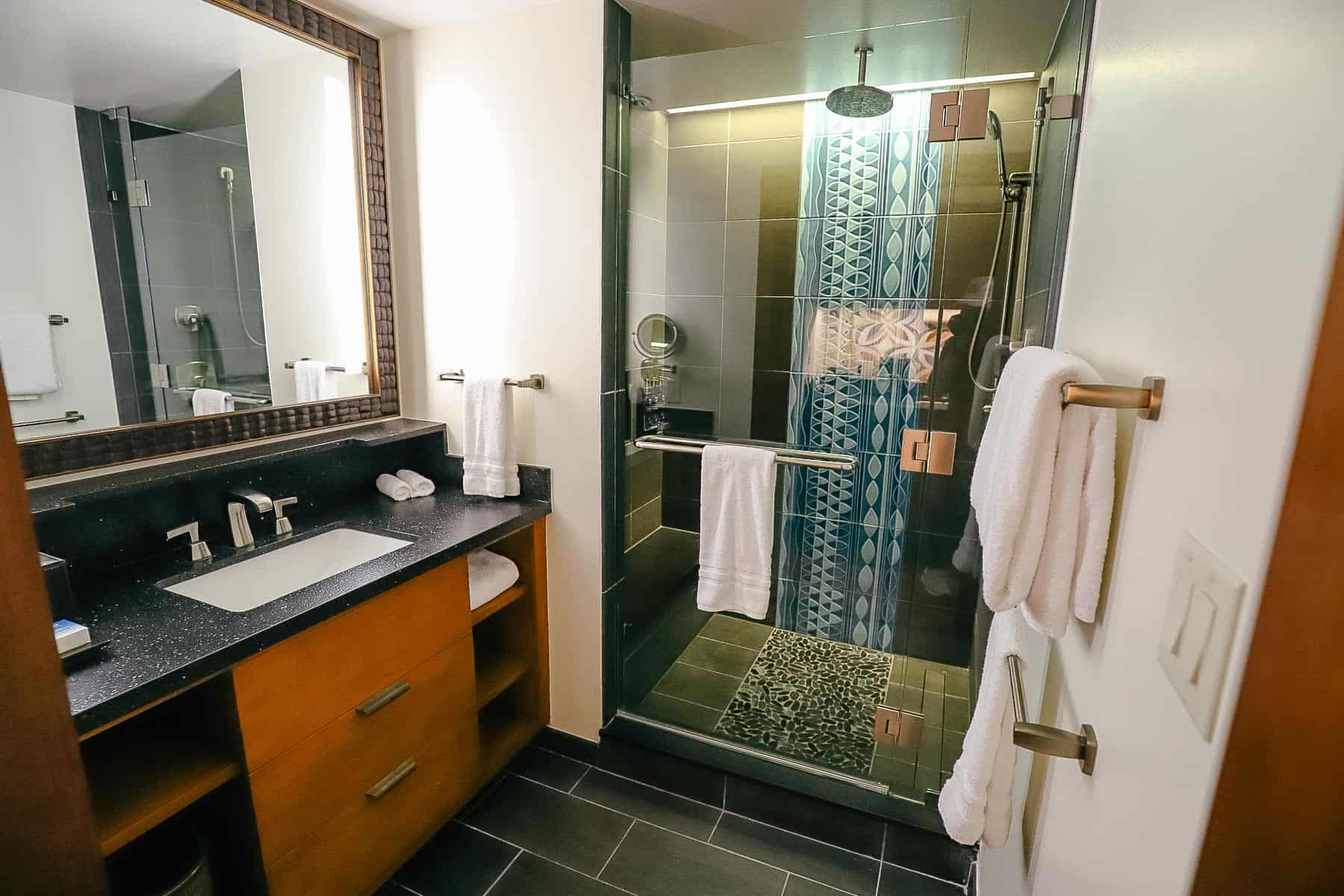 split bath with vanity and walk in shower 