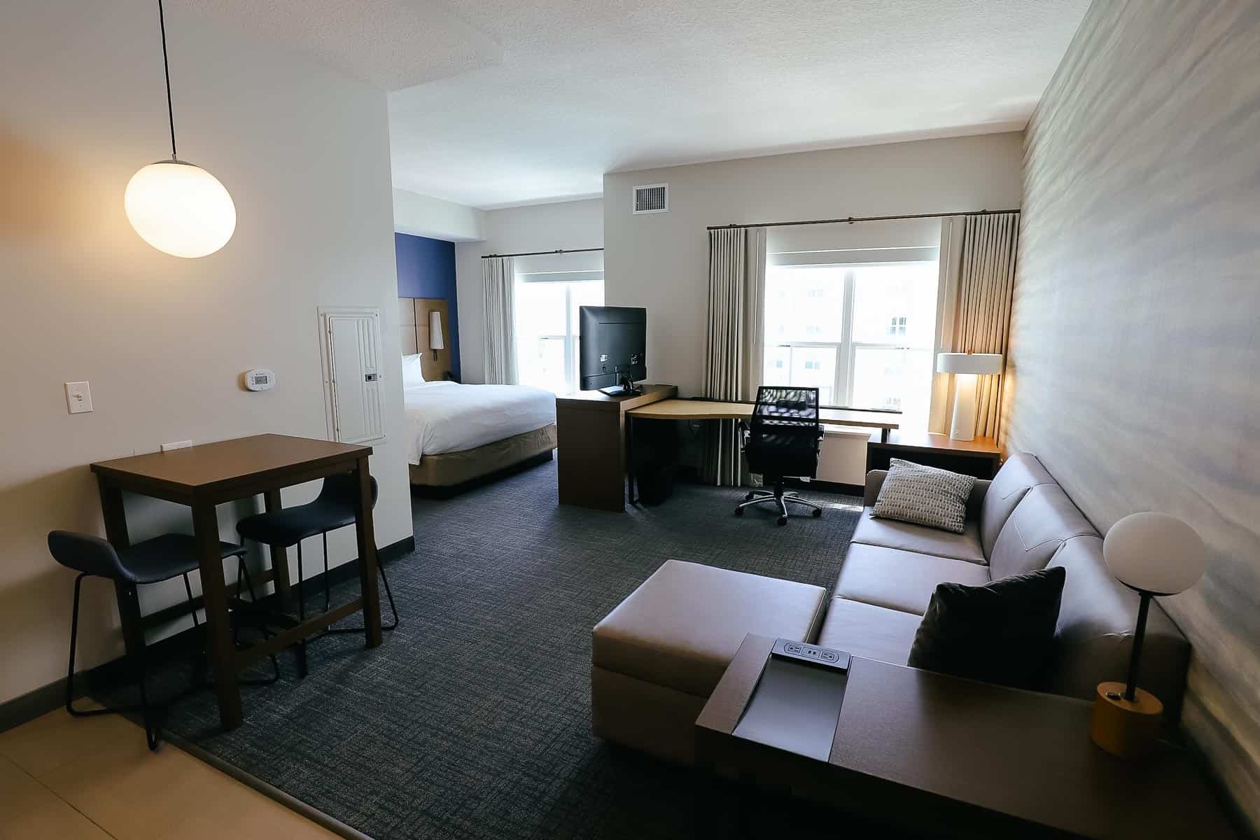 Living room and desk in a hotel room