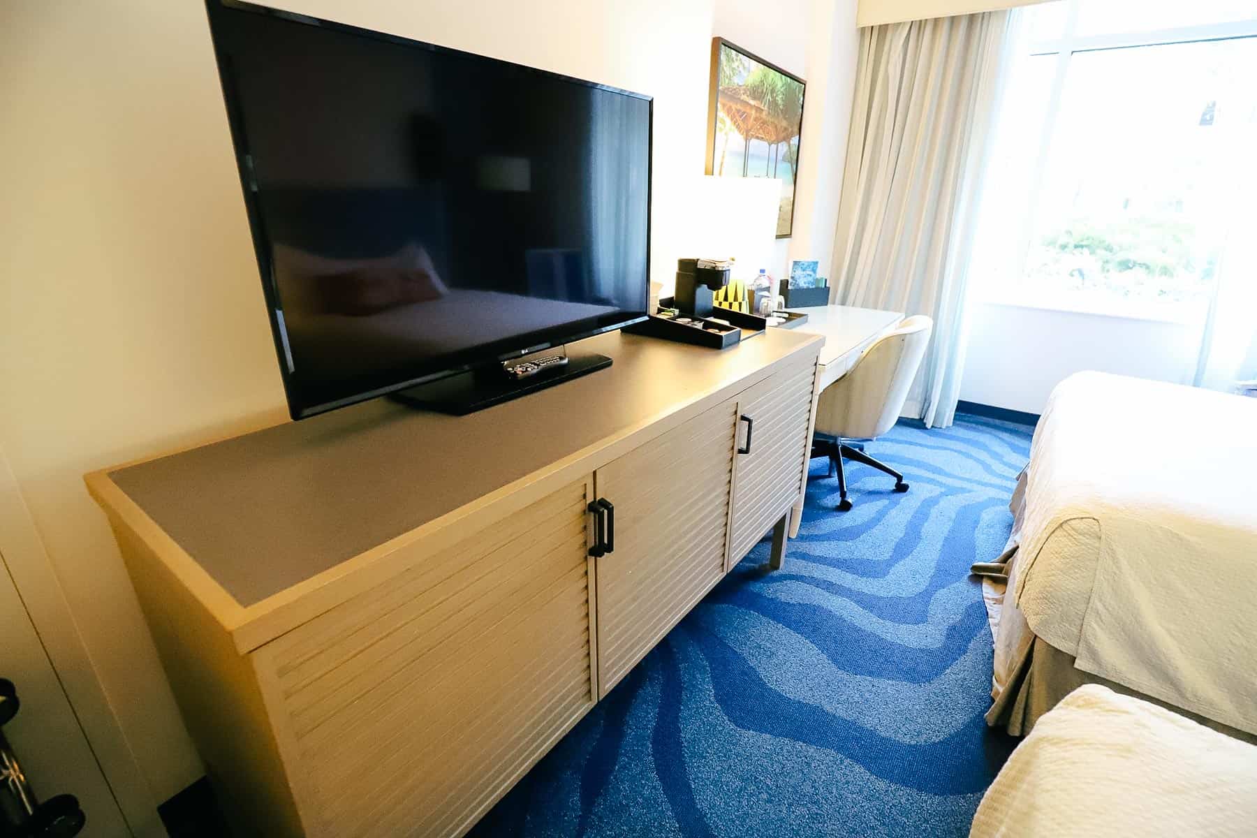 a television on a dresser stand in the room at Sapphire Falls