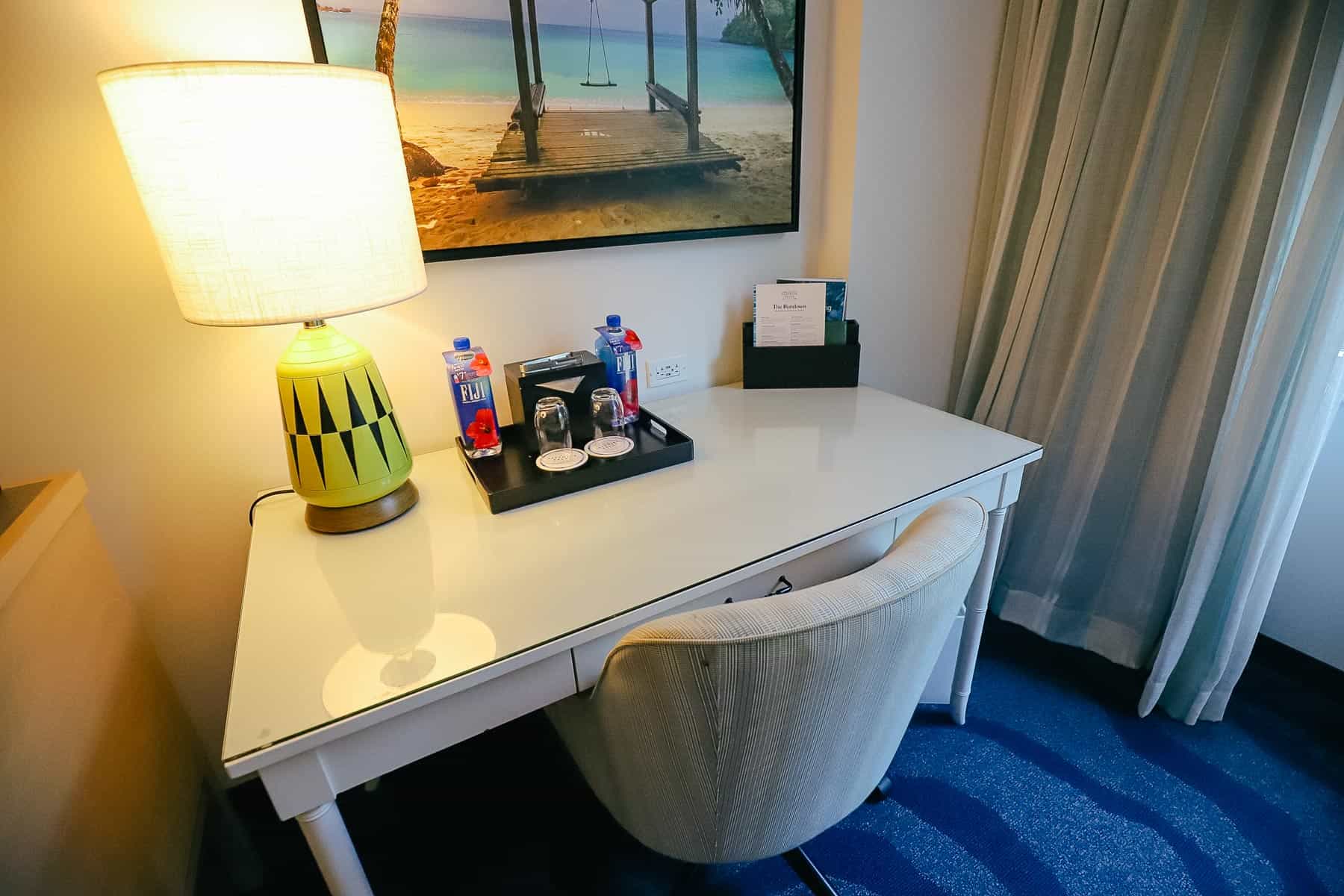 a desk with chair in our room at Loews Sapphire Falls Hotel