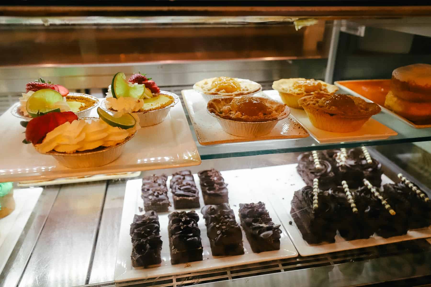a display case with refrigerated desserts like key like pie