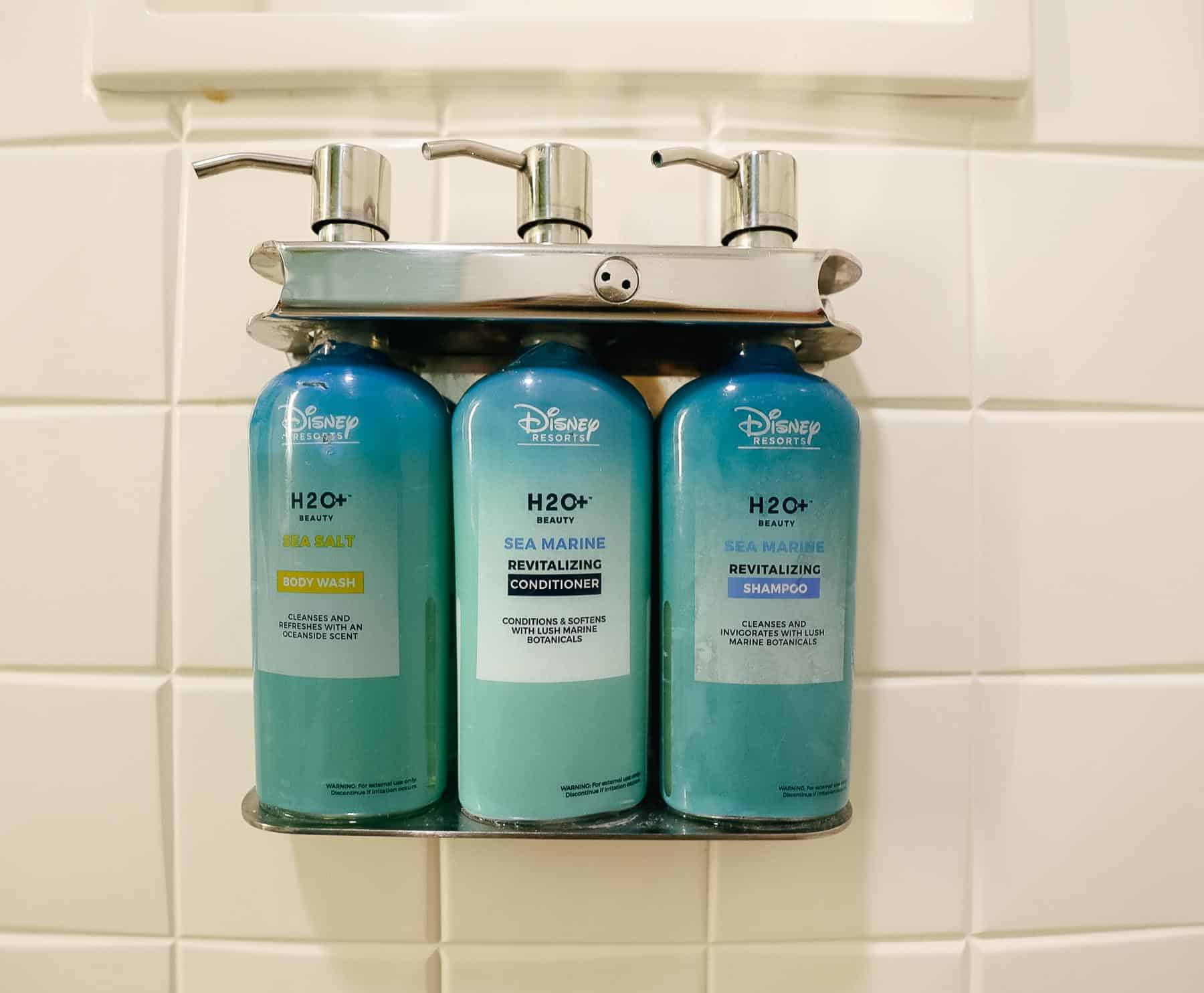 Body wash, conditioner, and shampoo built into the shower at the rooms at Disney's All-Star Music Resort. 