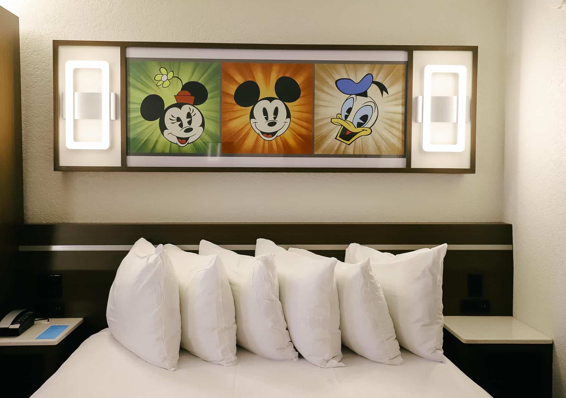 a light fixture over the beds at All-Star Music that shows Mickey and Friends 