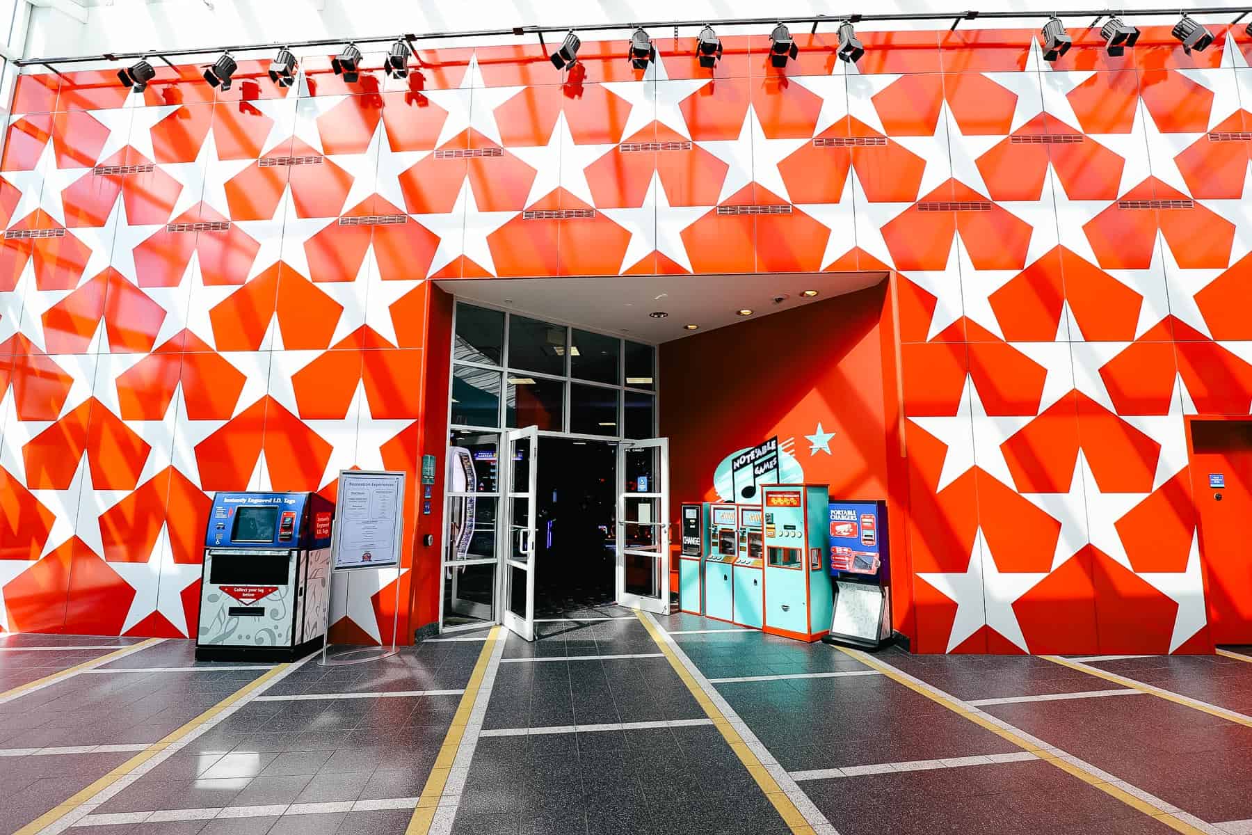 the red wall of stars outside the arcade at All-Star Music Resort 