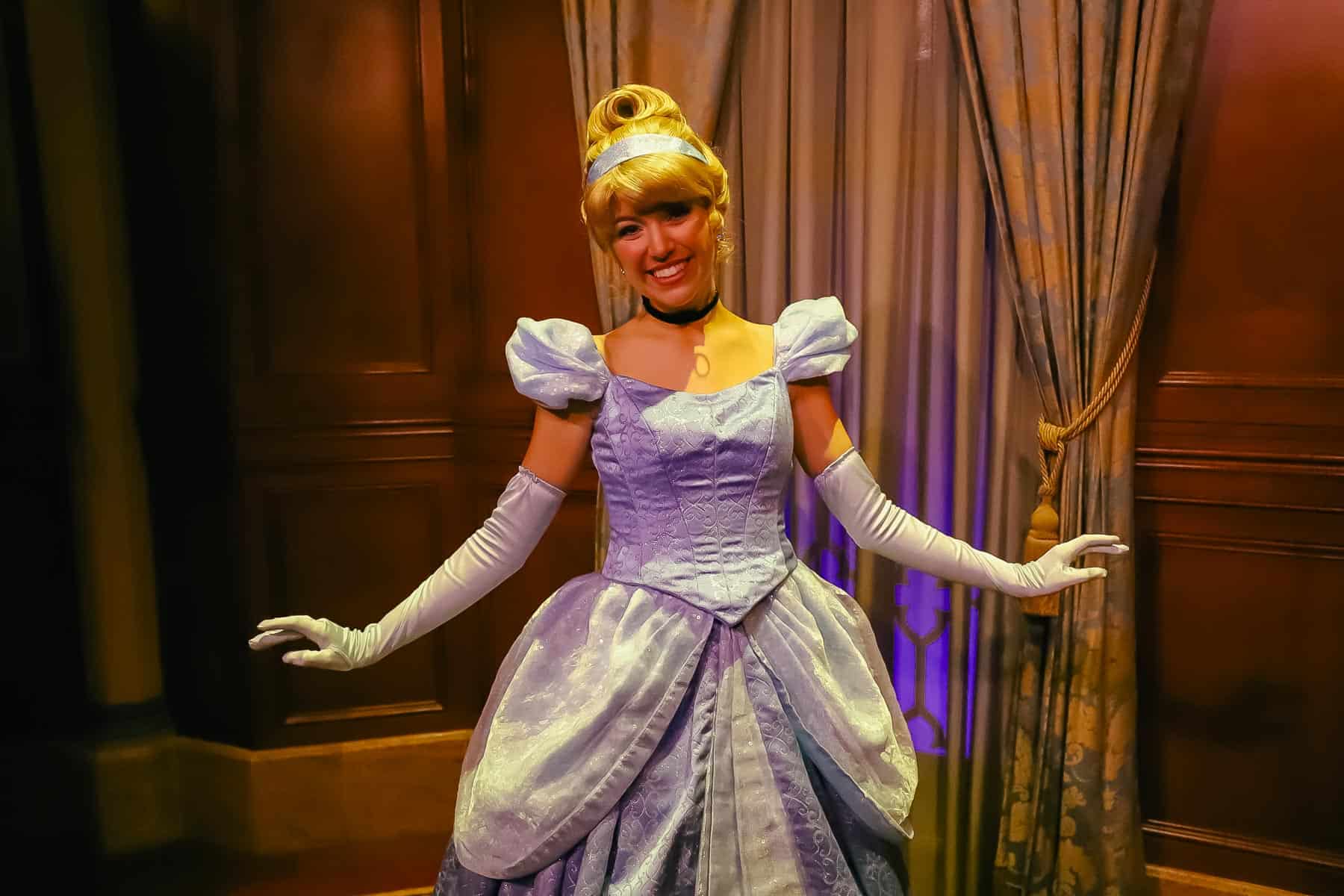 Cinderella posing for a photo at Magic Kingdom.