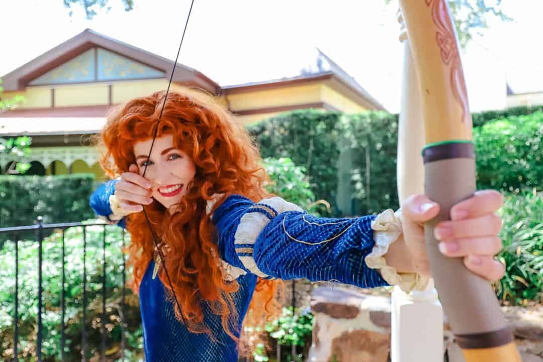 Merida posing with her bow at Magic Kingdom.