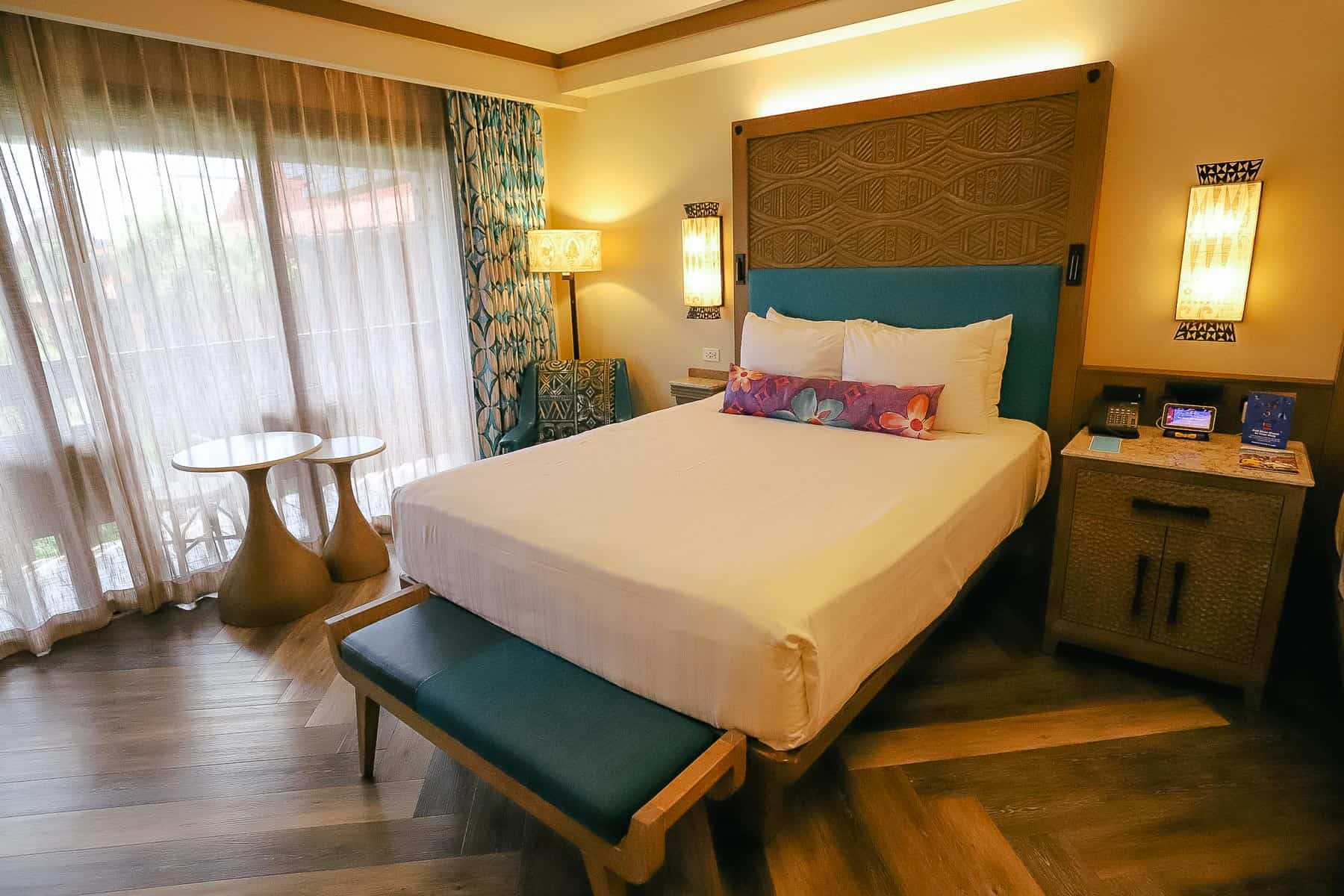 queen-size bed with bench at the end 