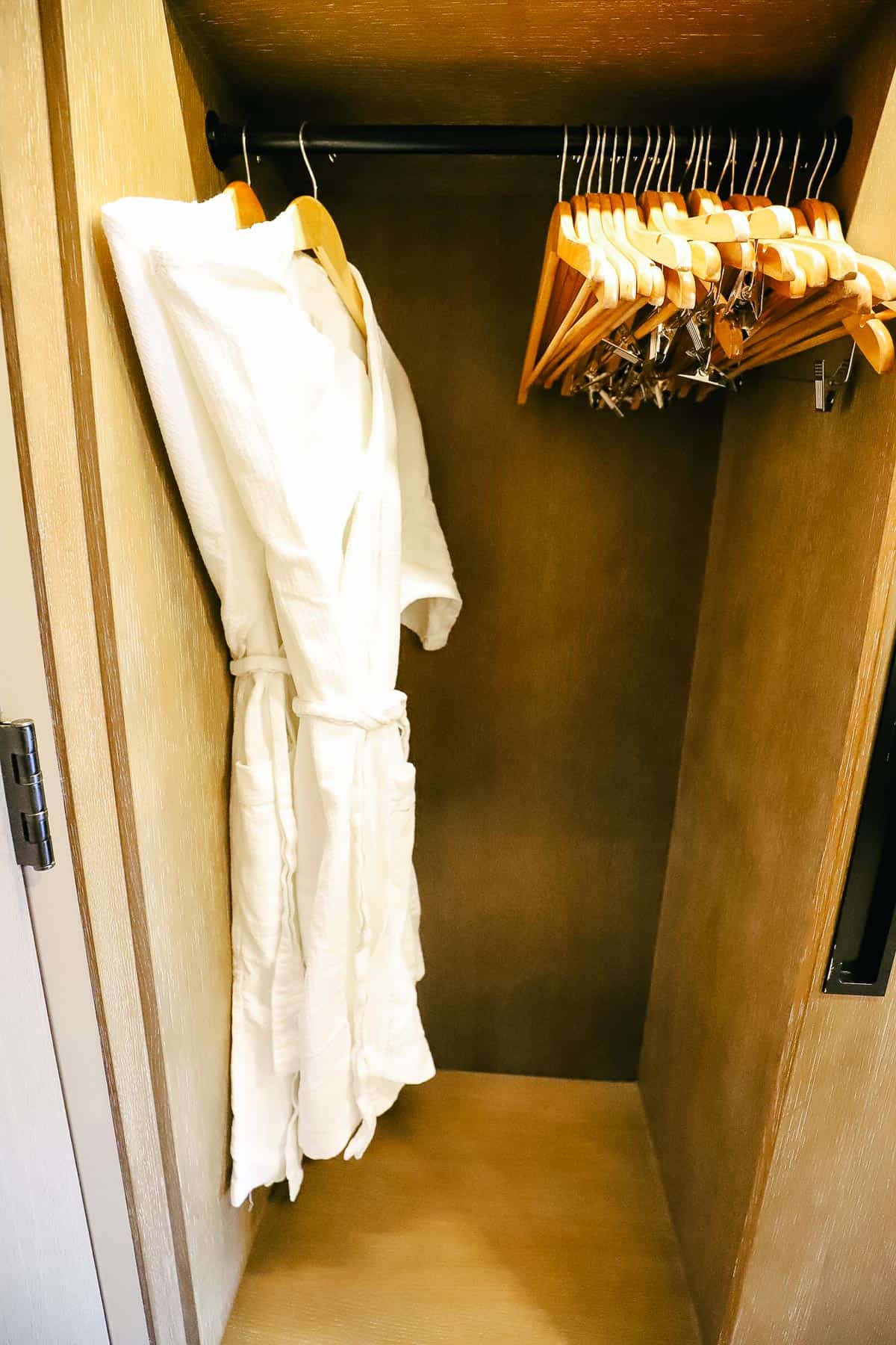 hotel robes hanging in closet 