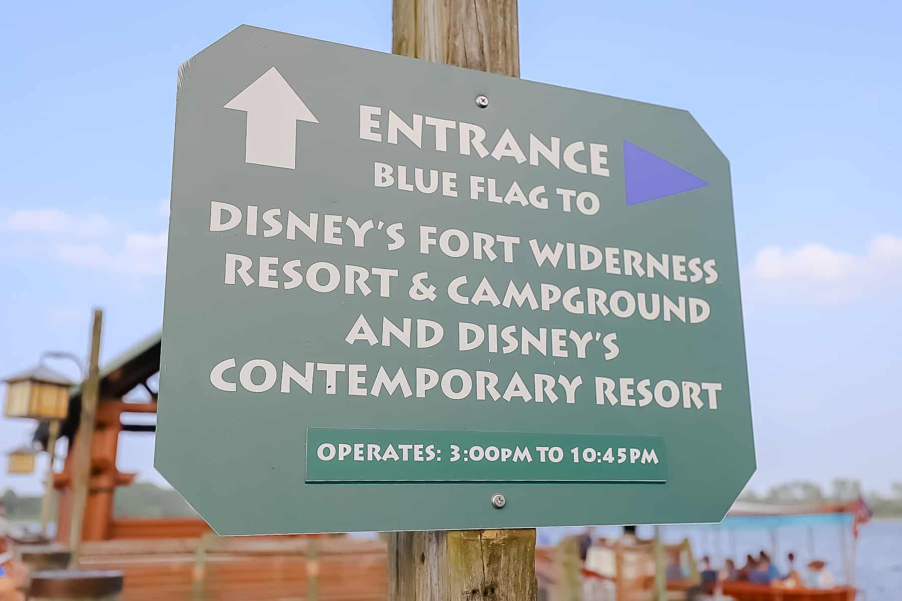 Sign indicating the blue flag entrance to the boat launch from Wilderness Lodge to Disney's Contemporary. 