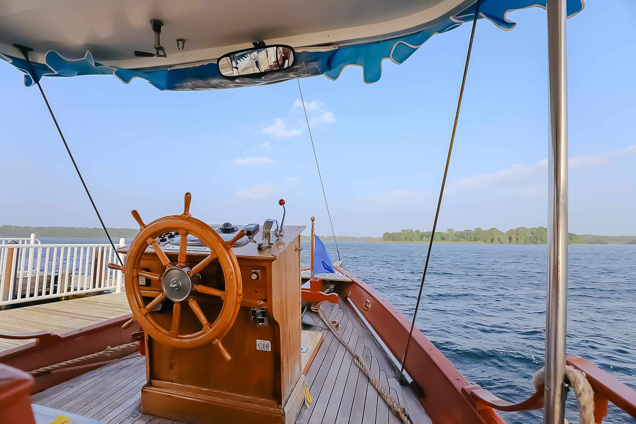 the wheel of the boat as it heads toward Fort Wilderness from the Contemporary 